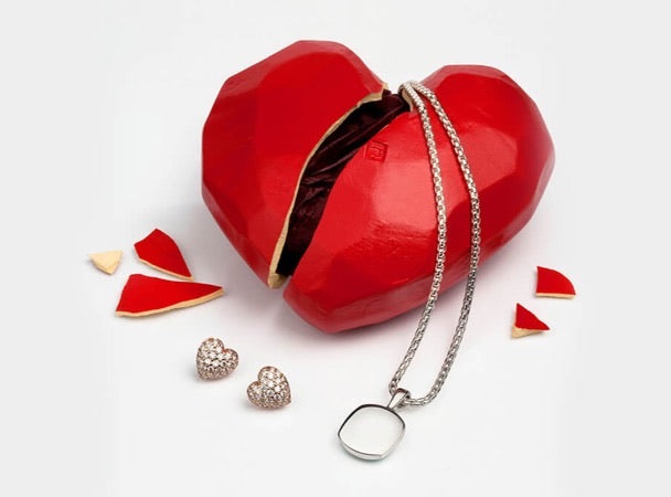 Heartbreak gift packaging broken open, with jewellery inside