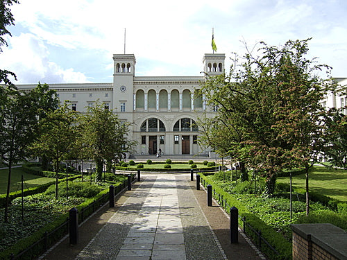 Hamburger Bahnhof art museum in Berlin, a white former station building at the end of a tree-lined path