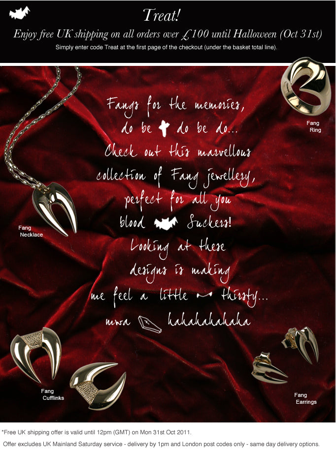 Fang jewellery on red velvet: a fang necklace, fang ring, fang cufflinks and fang earrings, with a Halloween offer