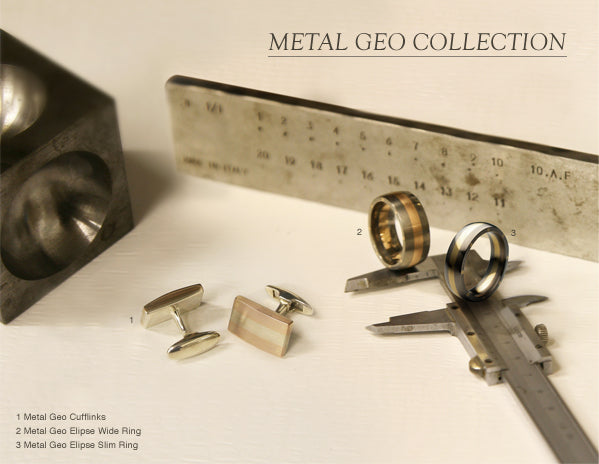 Metal Geo cufflinks and two Metal Geo Elipse rings on a steel ruler and calipers in the workshop