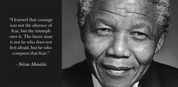 Black and white portrait of Nelson Mandela with his quote that courage is the triumph over fear