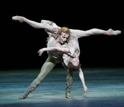 Two ballet dancers in a dramatic lift on stage in Manon at the Royal Opera House