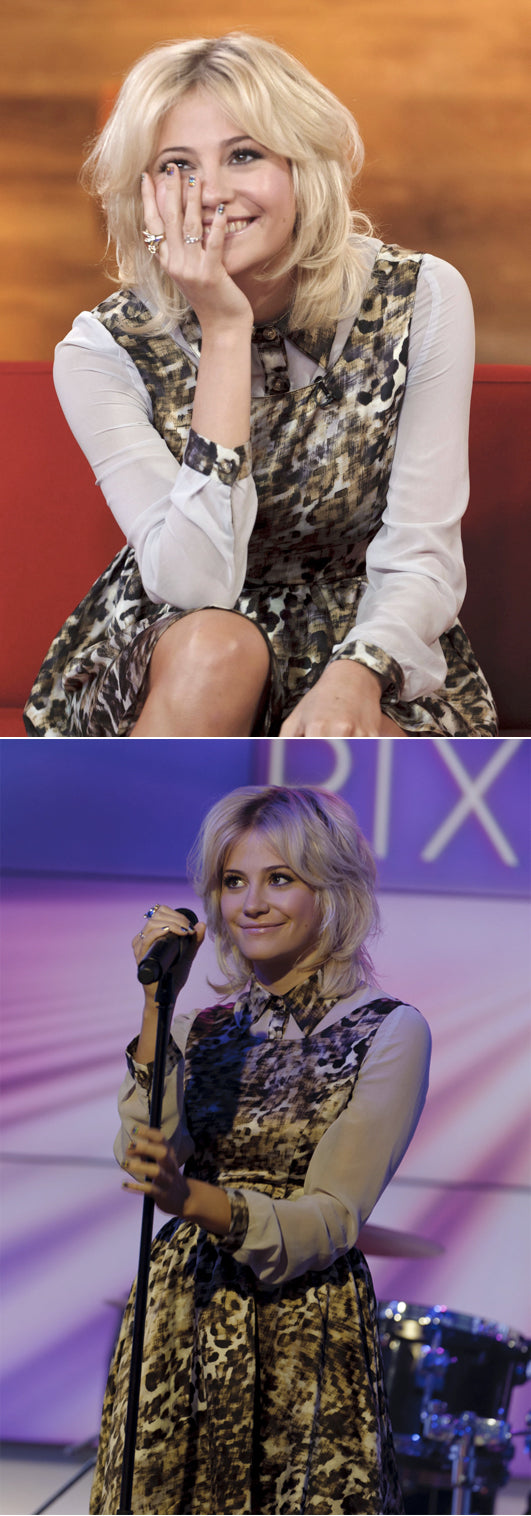 Pixie Lott in a leopard-print dress wearing the Lioness Ring and Love Ring, seated and singing into a microphone