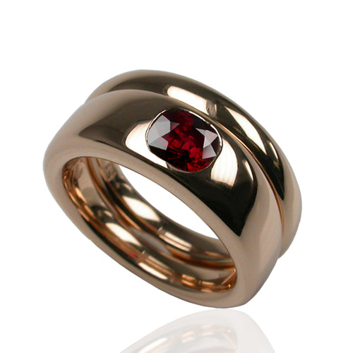 Vixen engagement and wedding ring set in 18ct rose gold with a cushion cut ruby set flush in the band