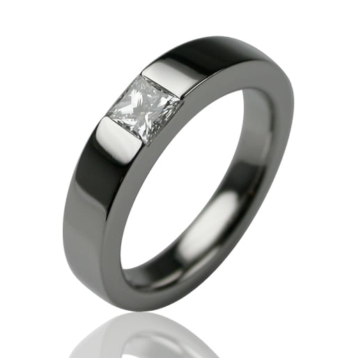 Platinum band ring with a princess cut diamond set across the top, the Times Square ring