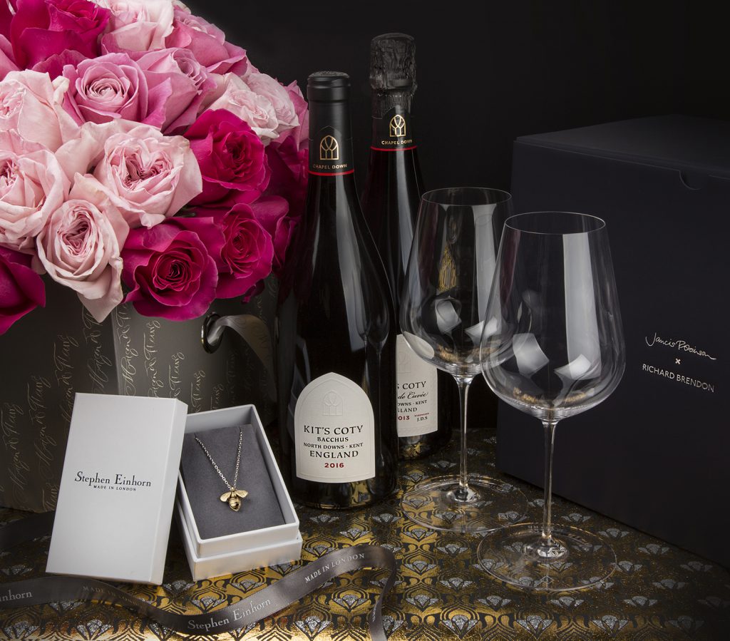 Competition prize: pink roses, two bottles of English sparkling wine, glasses and a gold pendant in its box