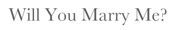 The words 'Will You Marry Me?' in grey serif lettering on a plain white background
