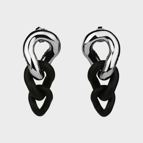 Front view of a pair of silver and black caster seed drop earrings.