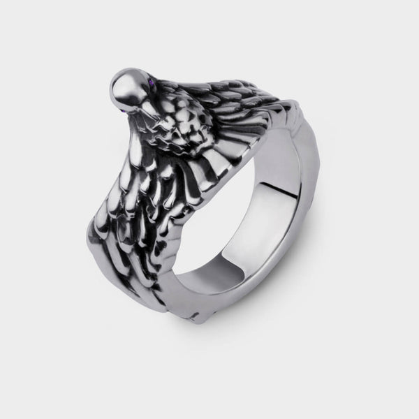 platinum phoenix ring made in silver with amethyst eyes.