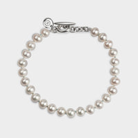 above profile of a single strand white pearl hope braclet.