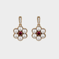 6 pearl drop earrings set with a central round ruby on a yellow gold and diamond clip.