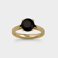 front view of a 2 carat rdiant light ring in yellow gold with a black sapphire.