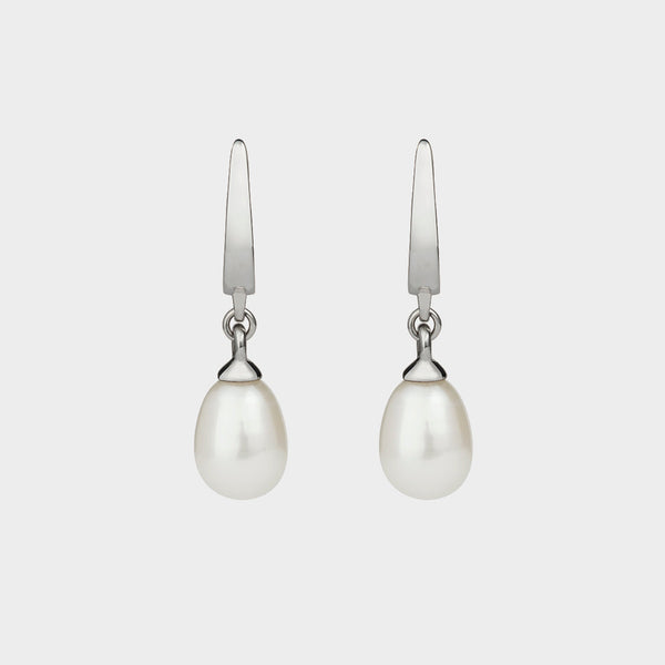 front close up of a pair of white vermeer earrings.